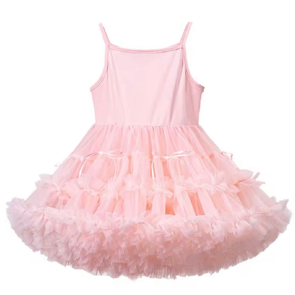 Girl standing wearing a pink tulle dress 